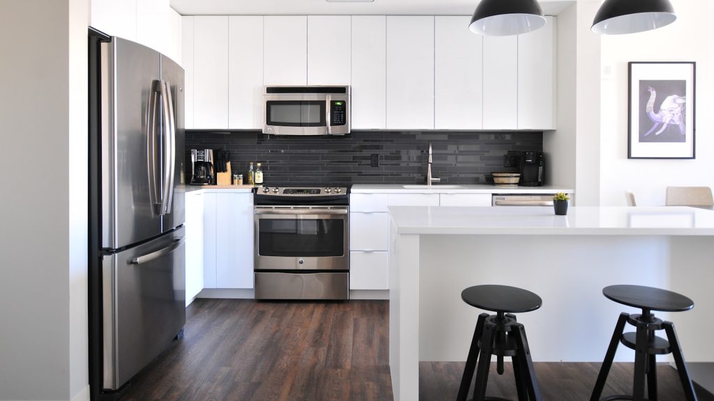 Stainless steel kitchen surfaces where hard water spotting shows most.